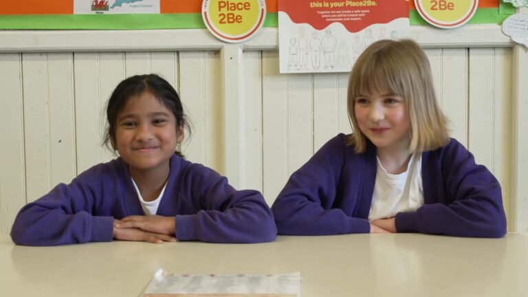 Two pupils filming for Children's Mental Health Week